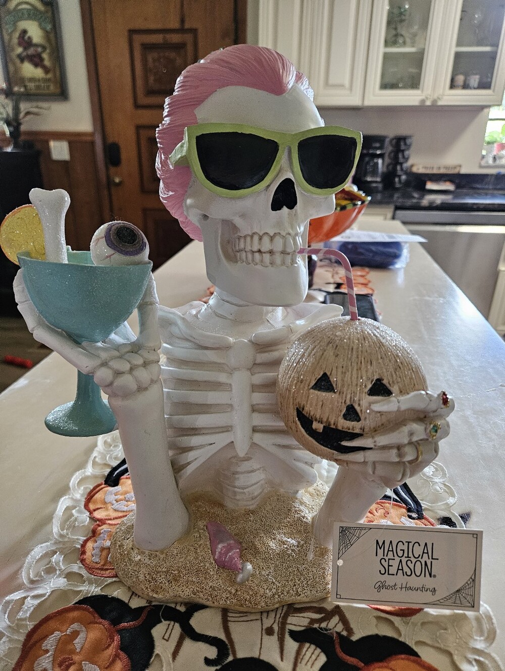 Tropical Halloween Skeleton Bust Decor holding Pumpkin Drink & Eyeball Martini